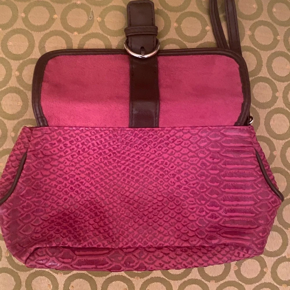 Red animal looking print Elizabeth Arden wristlet